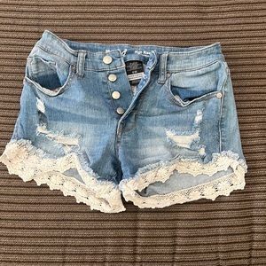 High rise short denim shorts with lace at the bottom size 0/25